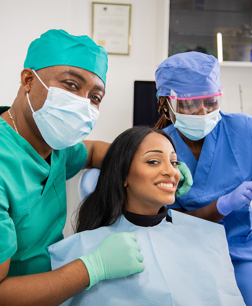 The Dentoc team with a smiling patient